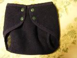 Small Snapping Recycled Wool Cover with Fleece Lining by Jezebel