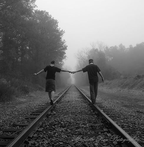 holding hands on the railway